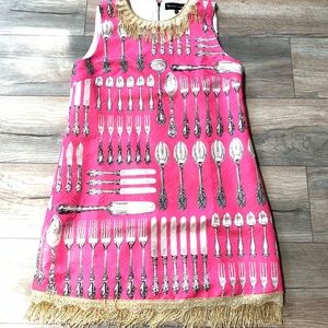Pink forks dress with gold fringe!